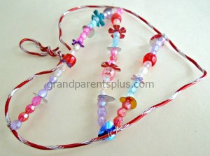 Thin wire is used to go back and forth after beading sparkly beads and sequins.